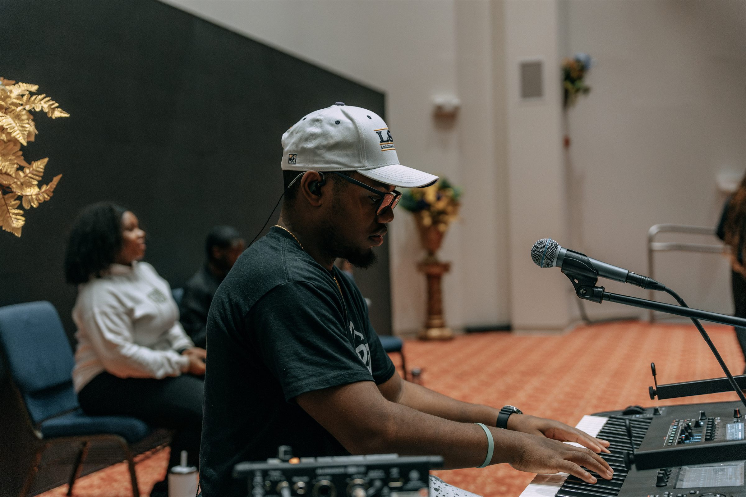 A OneVoice keys player at the mic during soundcheck